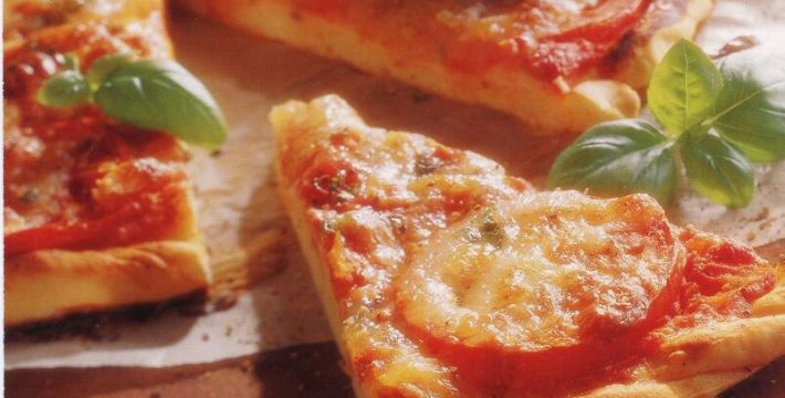 Close up photo of a few slices of pizza margherita