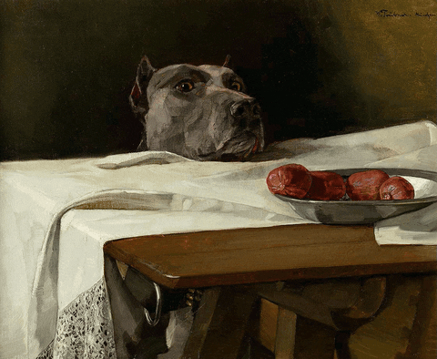 GIF: A dog peers over a table with a white cloth, eyeing a bowl of sausages.