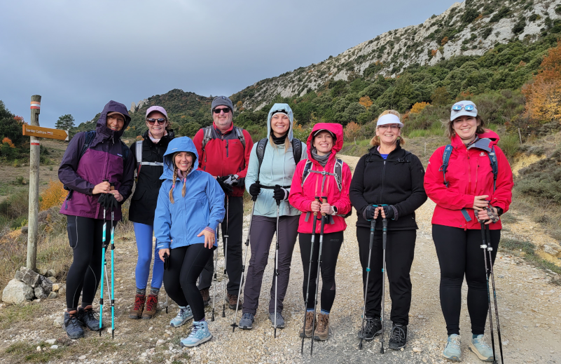 Hikers on a level 2 Athara Adventures tour standing outside of Peyrepertuse Castle